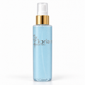 ‘Koriem Air Bloom Spray — pale blue liquid, silver logo and gold collar